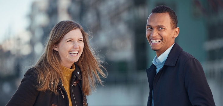 a man and a woman smiling